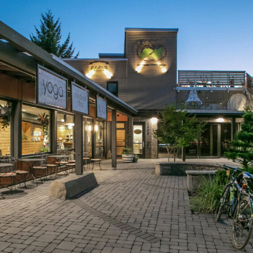 A shopping plaza at dusk.